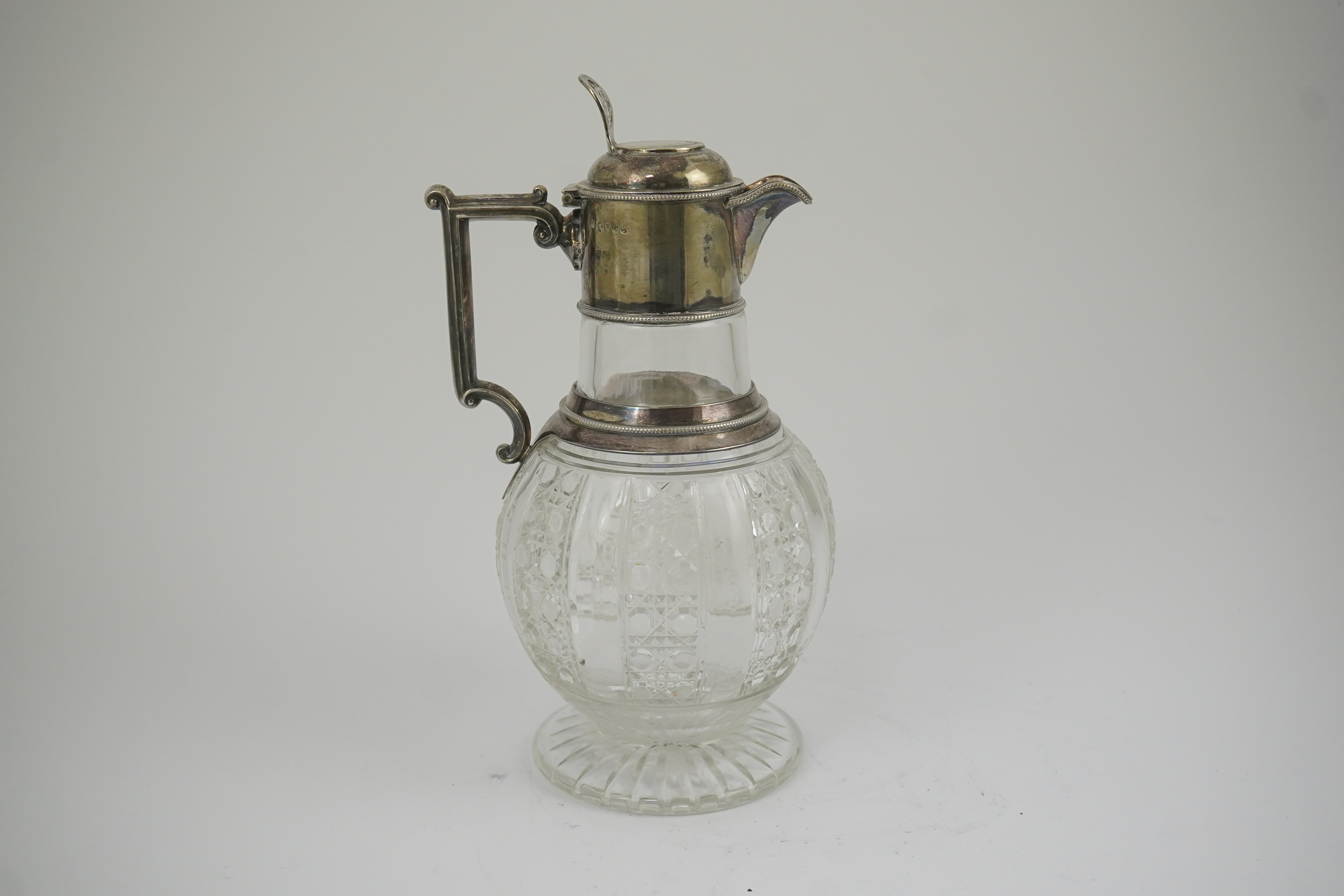 A late Victorian silver mounted cut glass claret jug, by Edward Hutton